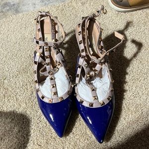 Blue patent rock stud pumps